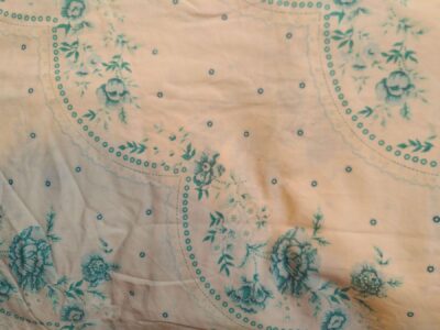 Enveloppe extérieure du Marmitou dans un tissu avec de petites fleurs couleur turquoise
